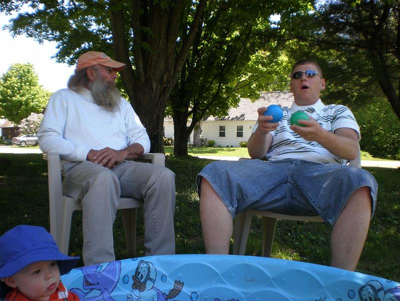 jtotheizzo 039.JPG - Grandpa Tom and Uncle Barney discuss the fine art of juggling.